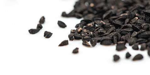 Cumin black seeds, caraway closeup isolated on white background, macro
