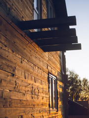 sunlight on the wall of a wooden house, Russia