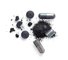 Activated charcoal capsule and Tablets isolated on white