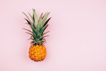 Yellow pineapple on stylish pink background. Flat lay style