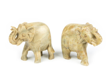Carved marble elephant on a white background