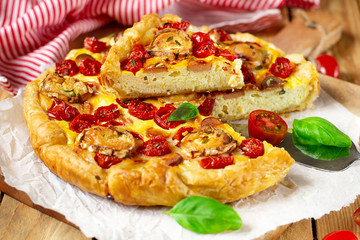 Savoury pastry quiche with cottage cheese, cherry tomatoes and goat cheese