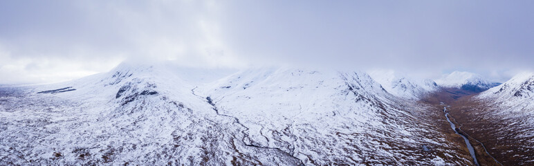 aerial drone shot of glen etive in the argyll region of the highlands of scotland showing loch etive and the entrance to glencoe