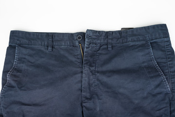 Closeup of male indigo pants on a white