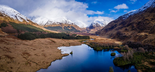 aerial drone shot of glen etive in the argyll region of the highlands of scotland showing loch etive and the entrance to glencoe - obrazy, fototapety, plakaty