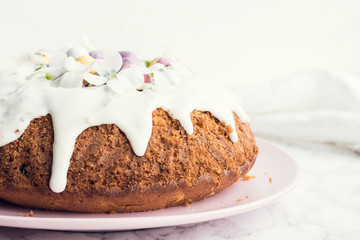 Glazed easter cake with flowers and candy