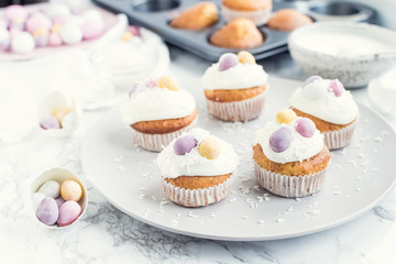 Glazed Easter cupcakes decorated with mini chocolate eggs