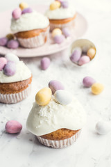 Glazed Easter cupcakes decorated with mini chocolate eggs