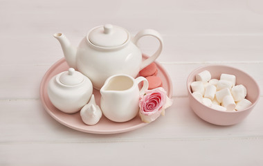 Spring card template. Happy Birthday or Valentine. Women's Day. Greeting card for mother's day. Congratulation with flowers. Flower card. Copy space. Wedding invitation.Tea set with flowers and sweet