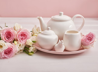 Spring card template. Happy Birthday or Valentine. Women's Day. Greeting card for mother's day. Congratulation with flowers. Flower card. Copy space. Wedding invitation.Tea set with flowers and sweet