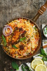 Homemade Fish Biryani served with yogurt Raita Salad, selective focus
