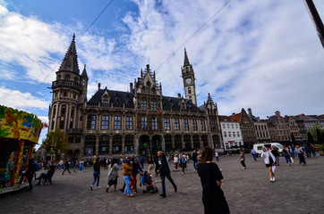 Ghent, Belgium, August 2019. Magnificent buildings overlook the streets of the historic center. People on the street.