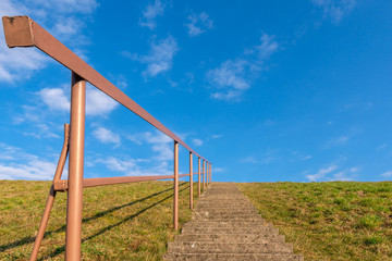 Concrete staircase against blue sky
