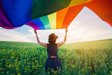 Gay Rainbow Flag on a green meadow outdoors