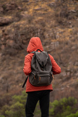young backpacker walking in the mountains