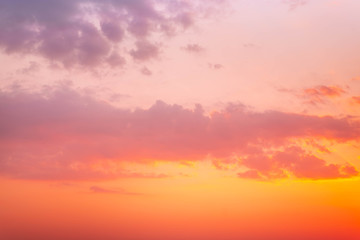 Colorful vibrant dramatic sky with purple to orange clouds. Sunset time