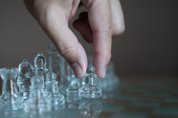 Chess board game made of glass, business competitive concept