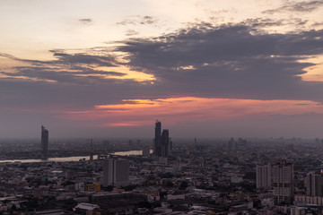 Beautiful view of Bangkok city, Beauty skyscrapers along Chaopraya river in the evening, making the city modern style.