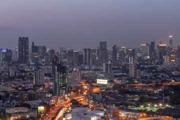 Sky view of Bangkok with skyscrapers in the business district in Bangkok in the evening beautiful twilight give the city a modern style.