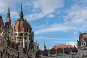 Fototapeta na wymiar Detail image of the hungarian Parliament in Budapest. Blue sky with clouds.