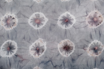 Fragment of hand-dyed fabric strip using shibori dyeing technique