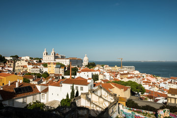 Obraz premium Cityscape view on the old town in Alfama district during the sunny day in Lisbon city, Portugal