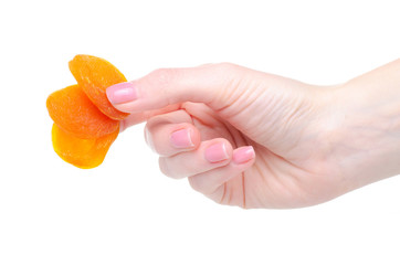 Dried apricots healthy sweet food in hand on white background isolation