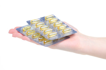 blister pills capsules in hand medicine and pharmacy on white background isolation