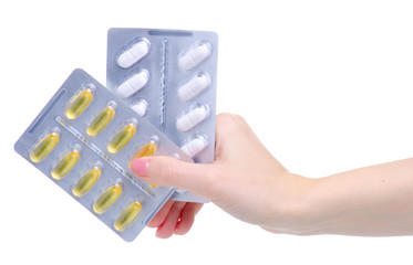 blister pills capsules in hand medicine and pharmacy on white background isolation