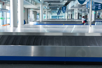 Baggage claim conveyor belt at the airport interior - 328541692