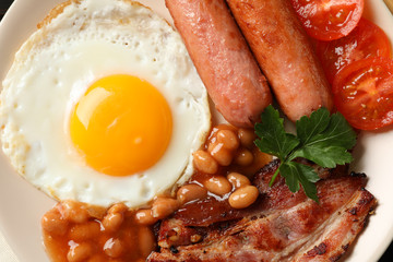 Delicious breakfast or lunch with fried eggs on whole background, close up