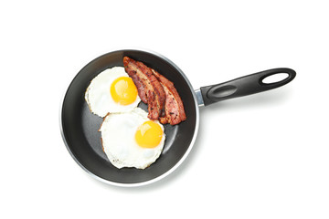 Pan with fried eggs and bacon isolated on white background