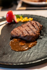 Delicious medium rare wagyu beef  steak with gravy sauce.