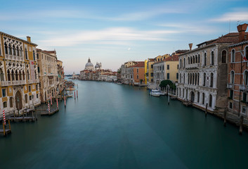 Fototapeta na wymiar Famous view of Basilica di Santa Maria della Salute and grand canal from Accademia Bridge, Venice, Italy.