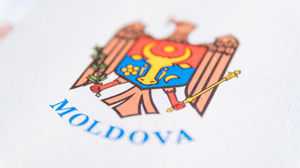 Republic of Moldova concept. The Moldovan passport on a blue and red background. Coloseup of the...
