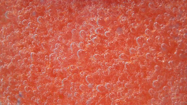 sponge for washing dishes , or body sponge with bubbles, underwater, selective focus. hygiene, macro, texture background