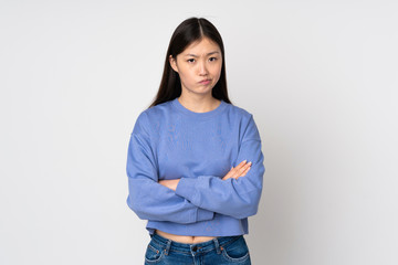 Fototapeta premium Young asian woman isolated on background feeling upset