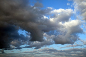 Fototapeta premium dramatic dark clouds over blue sky