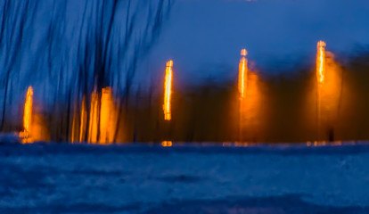 Reflection of light from streetlights on wet asphalt.