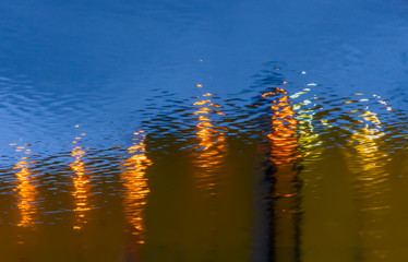 Reflection of light from streetlights on wet asphalt.