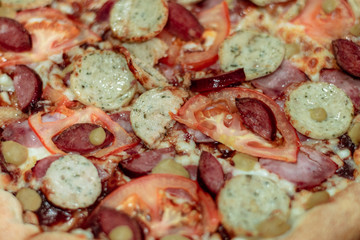 Fresh bavarian pizza close up. Delicious meat pizza ingredients