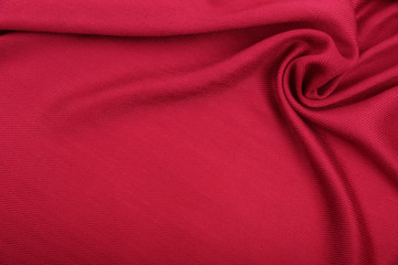 background of red fabric with creases and smooth copy space