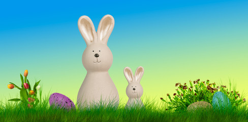 Fototapeta premium two easter bunnys stand on a meadow with easter eggs