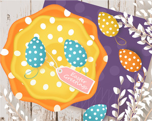 Easter banner with Easter eggs, colored plates, tag, willow, napkin on a wooden background