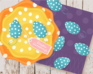 Easter banner with Easter eggs, colored plates, tag, napkin on a wooden background