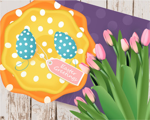 Easter banner with Easter eggs, colored plates, tag, pink tulips, napkin on a wooden background