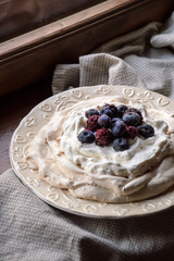cake with whipped protein cakes, butter cream and berries
