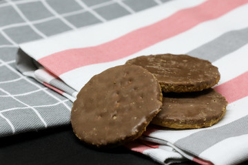 Cookies on a towel isolated on a black background.