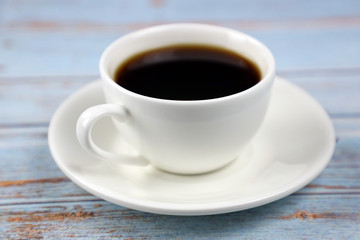 cup of coffee on wooden table