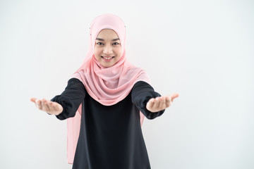 Half length portrait of asian beautiful Muslim young woman wearing business attire and hijab with mixed poses and gestures isolated on grey background. Suitable for technology, business finance theme.